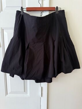 Black pleated mini skirt